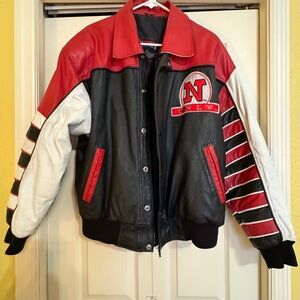 UNLV Rebels leather jacket. Zipper and button closure. Like new condition.